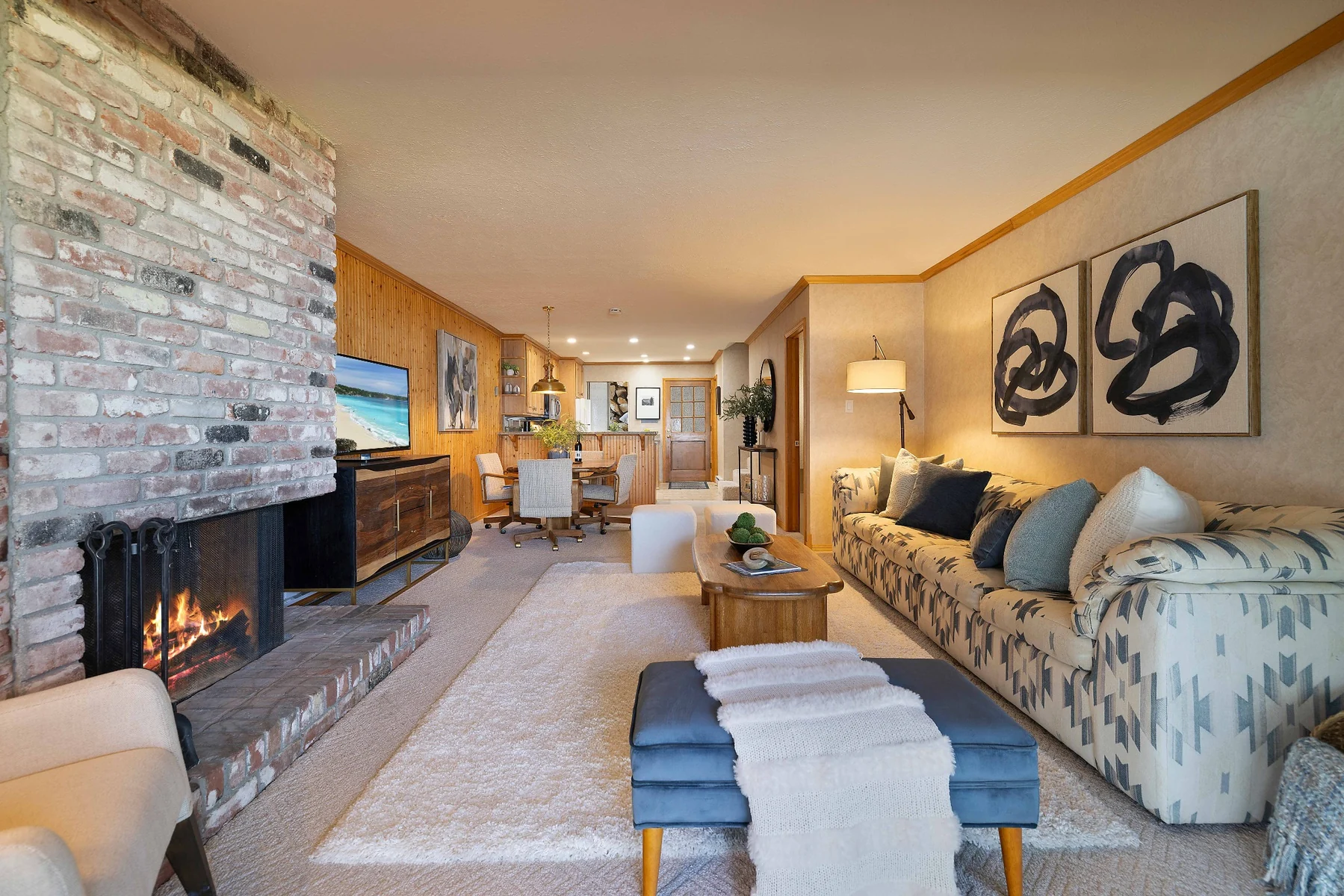 Living room with brick fireplace and open layout