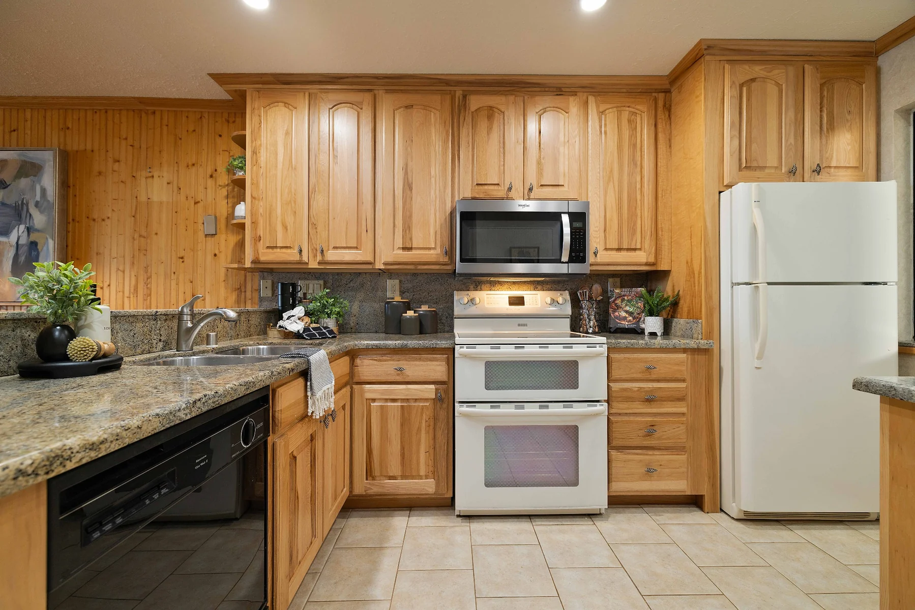 Kitchen with wood cabinetry and granite counters