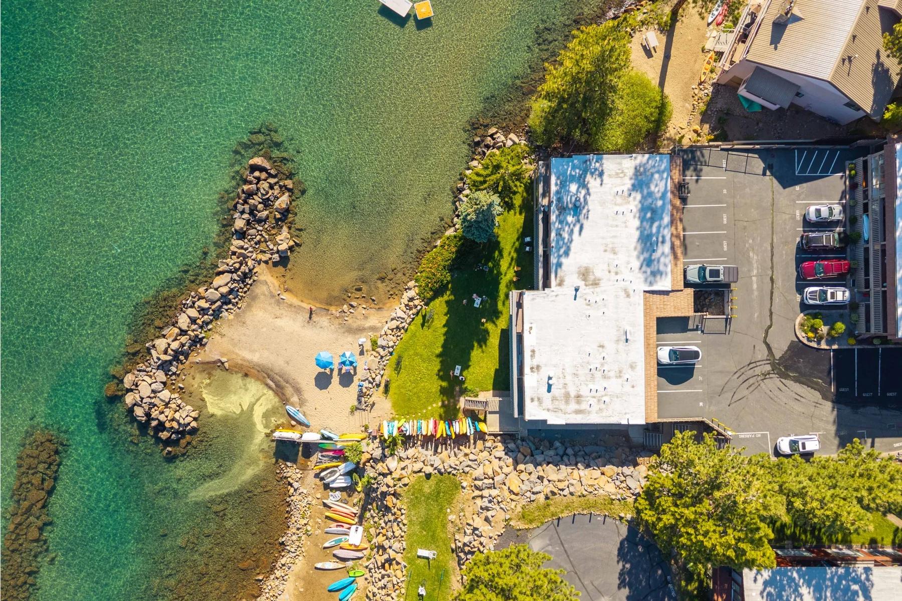 Top-down aerial view of private beach and building