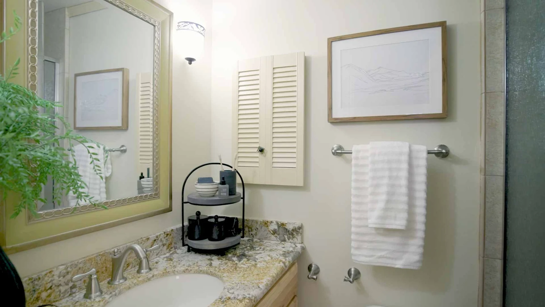 Bathroom vanity with mirror and shower