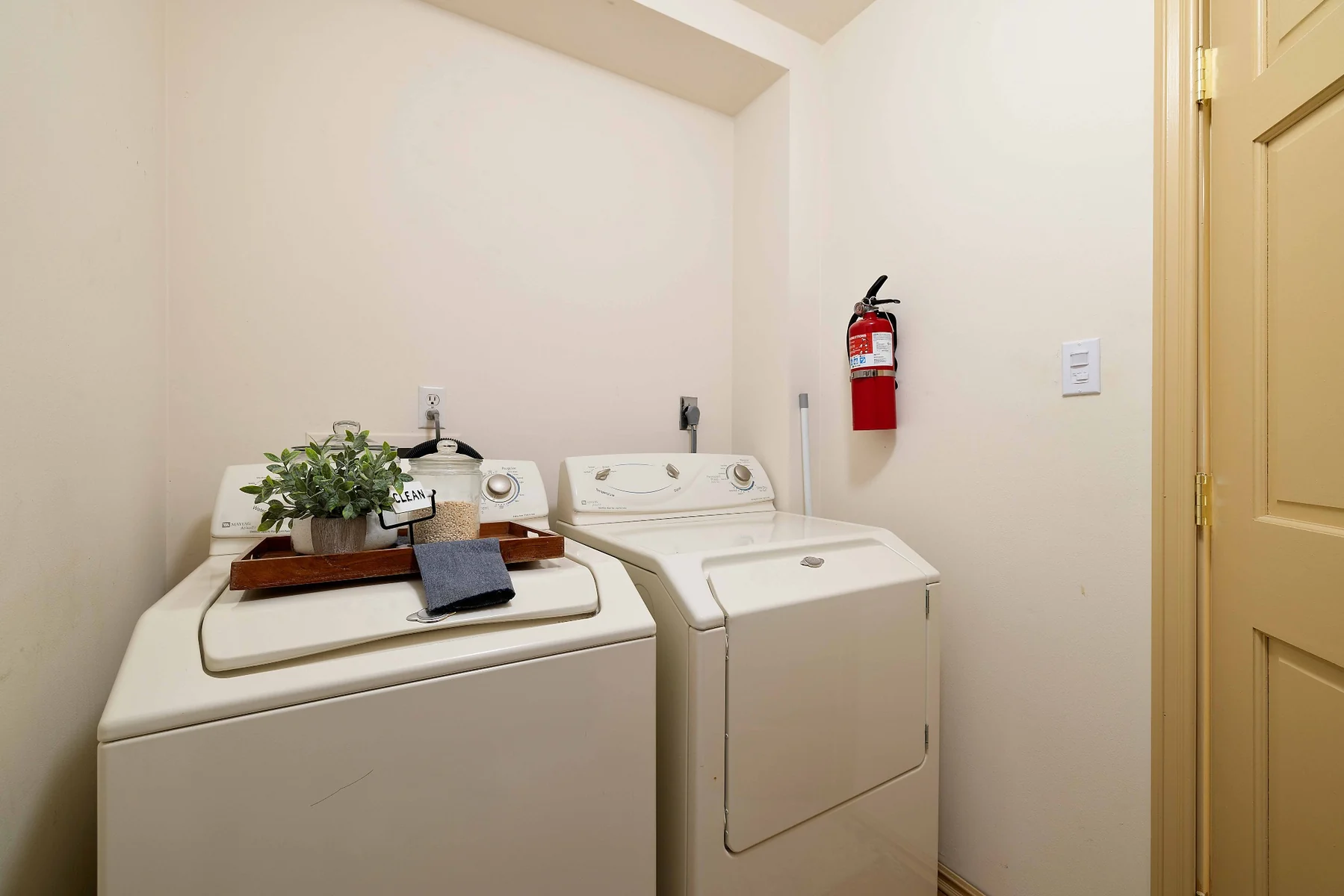 In-unit laundry room with washer and dryer